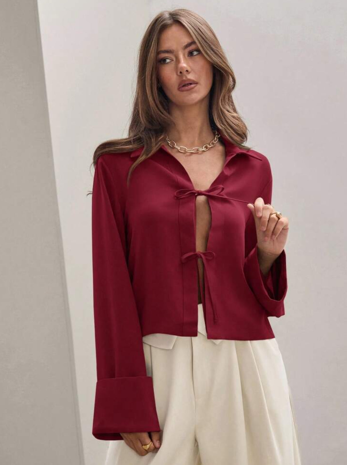 Blusa manga larga amarre frontal